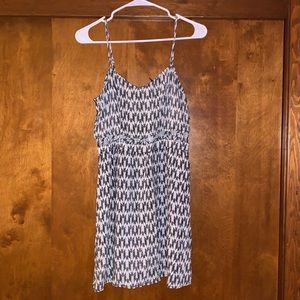 Thin strap dress with open mid-drift.